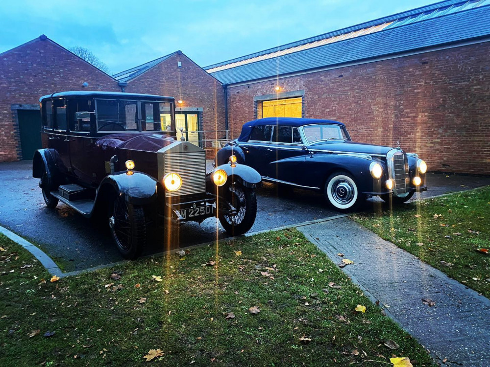 Classic cars outside the workshops